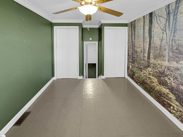 interior space featuring ornamental molding and ceiling fan