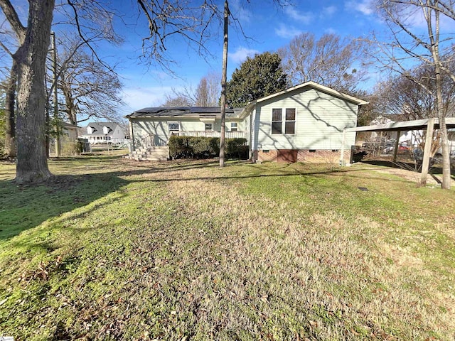 back of property featuring a lawn