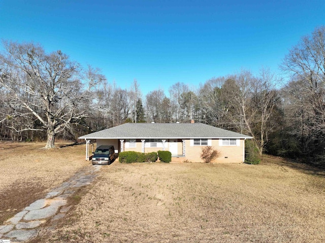 view of front facade with a carport and a front lawn