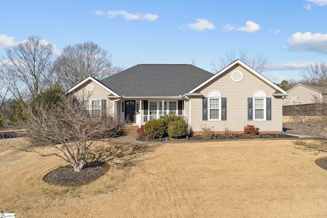 view of front of home featuring covered porch and a front yard