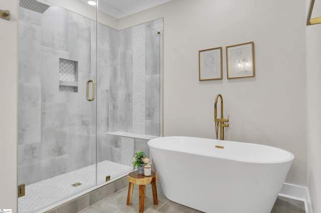 bathroom featuring tile patterned flooring and separate shower and tub