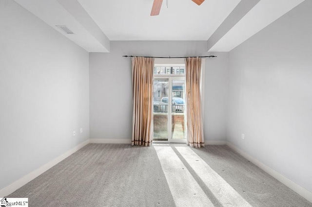 carpeted empty room featuring ceiling fan