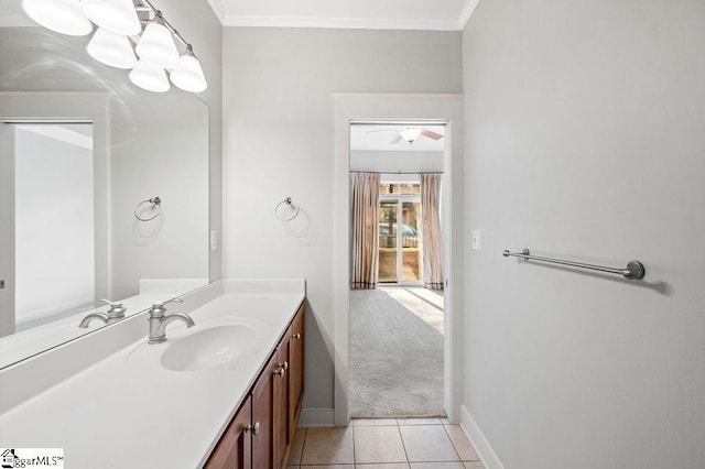 bathroom with tile patterned flooring, crown molding, and vanity