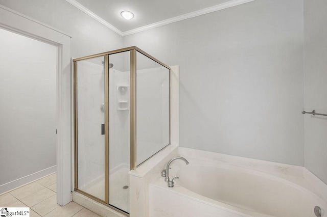 bathroom featuring plus walk in shower, tile patterned floors, and crown molding