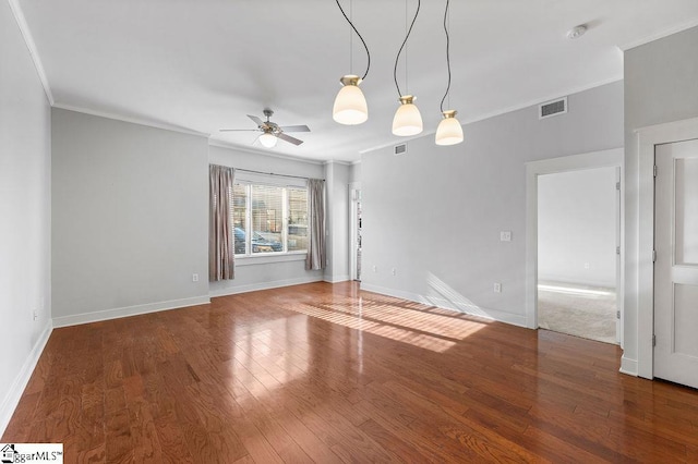 empty room featuring crown molding, ceiling fan, and hardwood / wood-style flooring