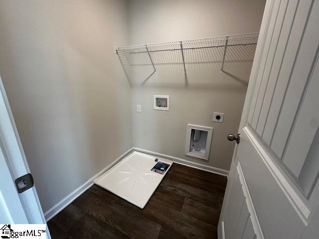 laundry room featuring electric dryer hookup, dark hardwood / wood-style floors, and washer hookup