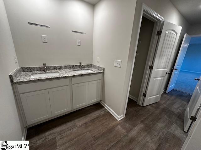 bathroom featuring vanity and hardwood / wood-style floors