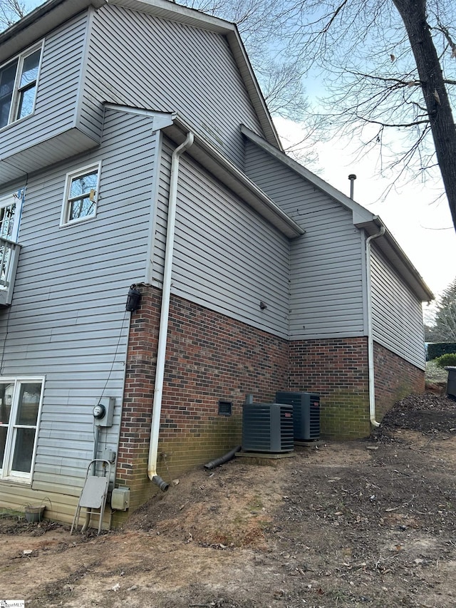 view of home's exterior featuring central AC unit