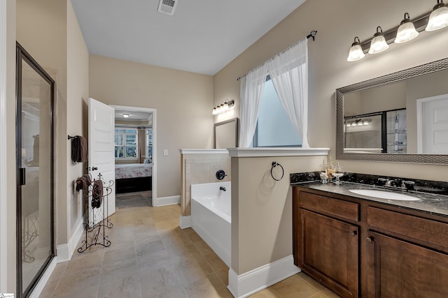 bathroom featuring vanity and separate shower and tub