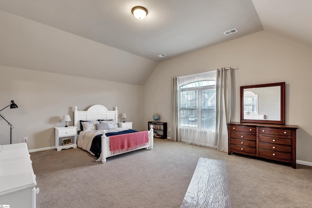 carpeted bedroom with vaulted ceiling