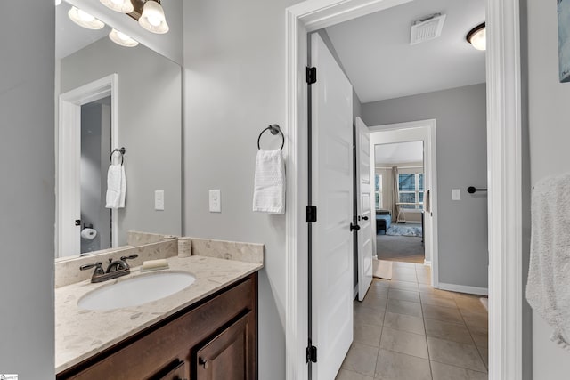 bathroom with tile patterned flooring and vanity