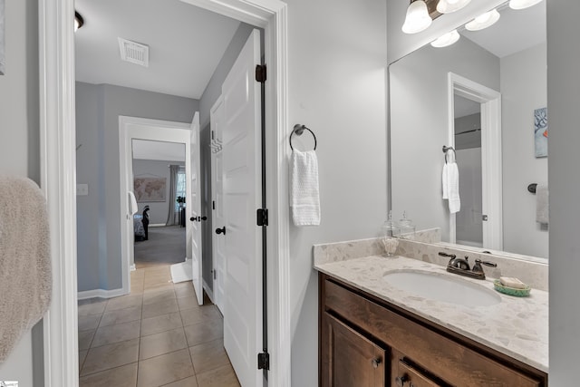 bathroom featuring vanity and tile patterned flooring