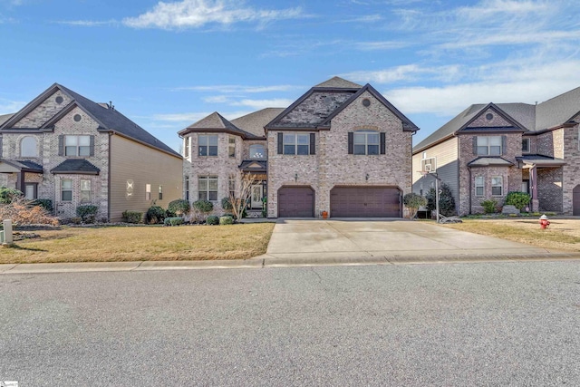 view of front of house with a garage and a front lawn