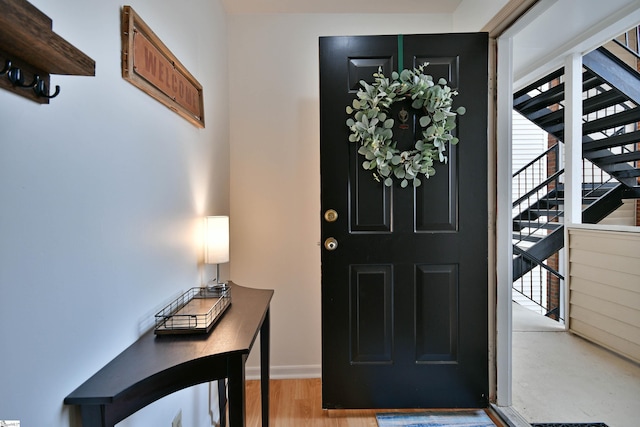 foyer entrance with light hardwood / wood-style flooring