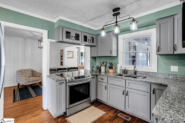 kitchen featuring sink, pendant lighting, light stone counters, gray cabinets, and electric stove