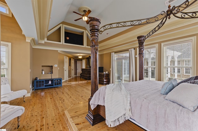 bedroom with crown molding, high vaulted ceiling, and multiple windows