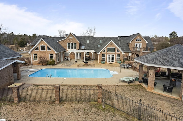 view of swimming pool with french doors, a patio area, a gazebo, a diving board, and a pergola