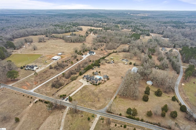 birds eye view of property with a rural view