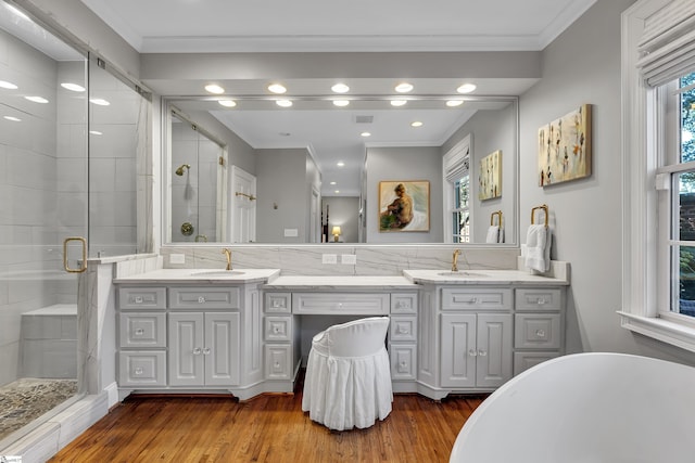 12 Cothran St, Greenville, SC 29605 - bathroom with vanity, hardwood / wood-style floors, ornamental molding, and shower with separate bathtub