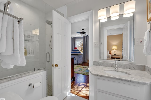 12 Cothran St, Greenville, SC 29605 - bathroom with ceiling fan, vanity, a shower with door, and hardwood / wood-style floors
