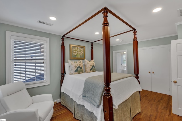 12 Cothran St, Greenville, SC 29605 - bedroom featuring crown molding, wood-type flooring, and a closet