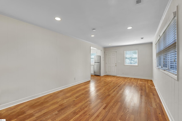 12 Cothran St, Greenville, SC 29605 - spare room featuring light hardwood / wood-style flooring and ornamental molding