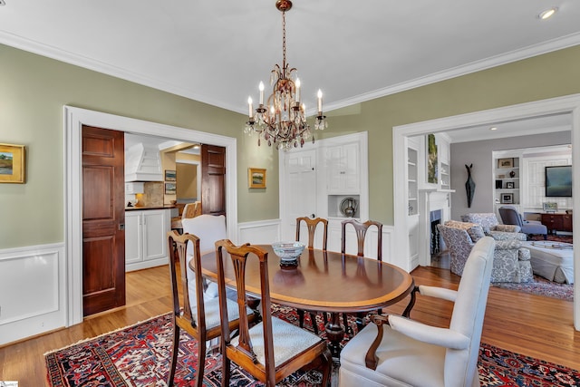 12 Cothran St, Greenville, SC 29605 - dining room featuring ornamental molding, built in features, and light hardwood / wood-style flooring