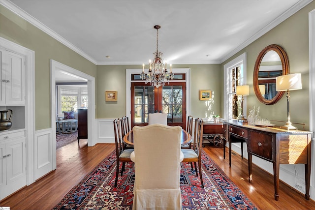 12 Cothran St, Greenville, SC 29605 - dining room with crown molding, wood-type flooring, and a notable chandelier