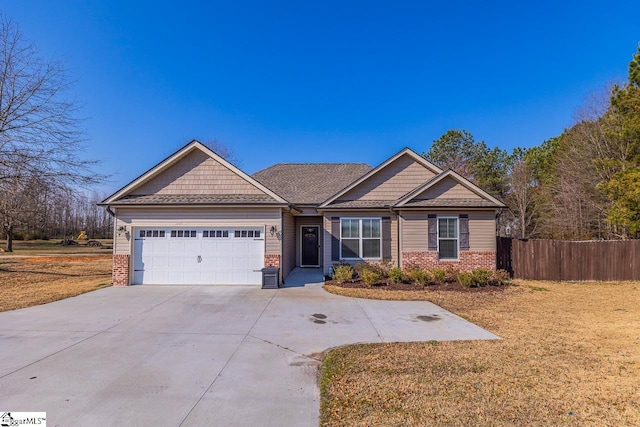 craftsman-style home with a garage and a front lawn