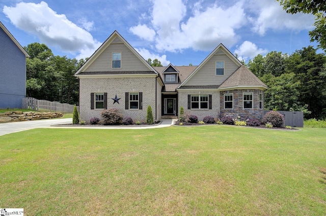 craftsman-style home featuring a front lawn