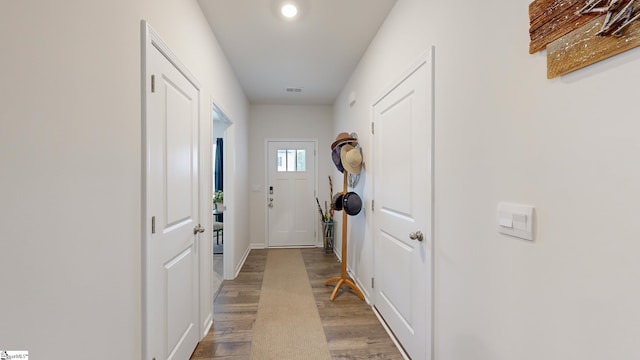 doorway with hardwood / wood-style floors