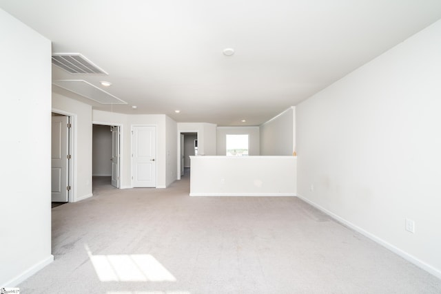 empty room featuring light carpet