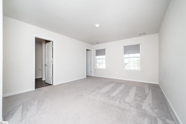 spare room featuring carpet flooring