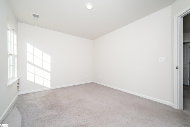 spare room with carpet flooring