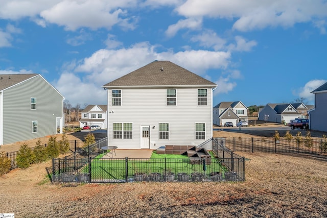 back of house featuring a yard and a patio area