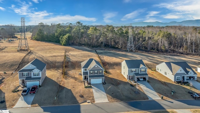 birds eye view of property with a mountain view