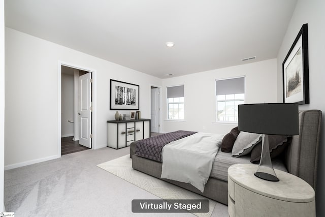 bedroom with light carpet