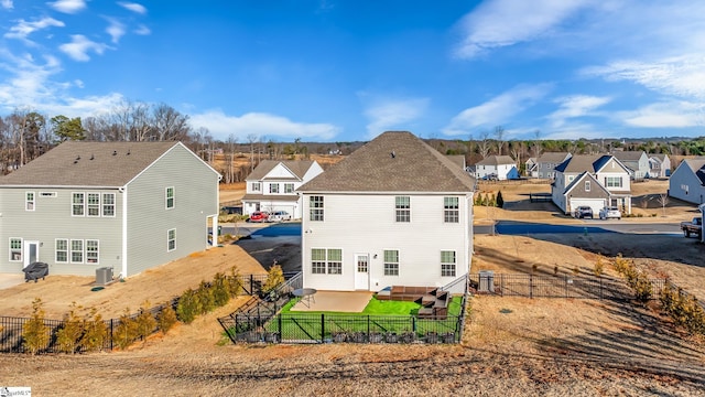 back of property featuring central AC unit and a patio