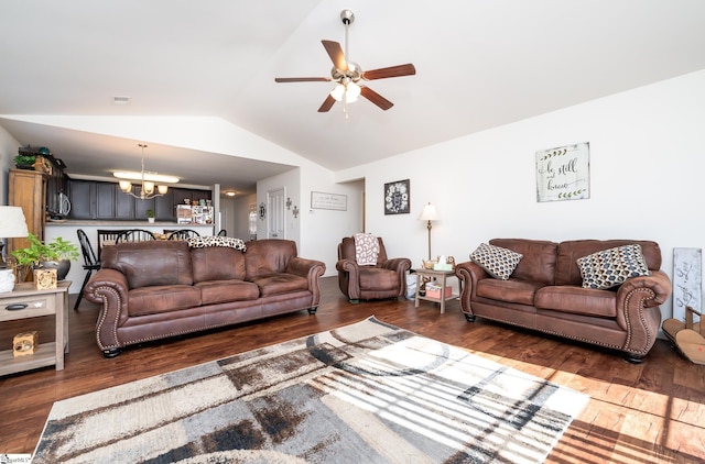 living room featuring lofted ceiling, ceiling fan with notable chandelier, and dark wood-type flooring