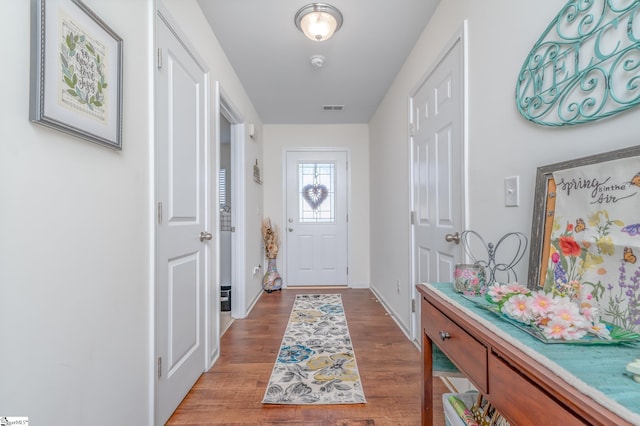 doorway to outside featuring hardwood / wood-style flooring