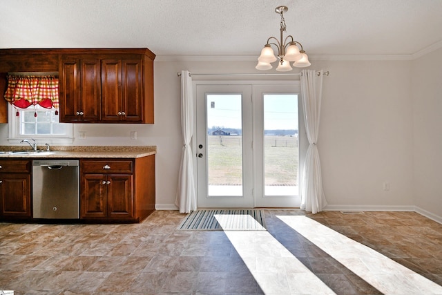 kitchen with pendant lighting, light countertops, stainless steel dishwasher, a sink, and a chandelier