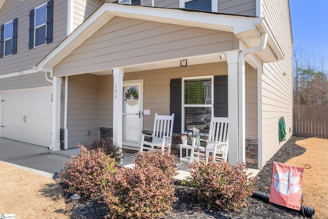 view of front of property featuring a porch and a garage