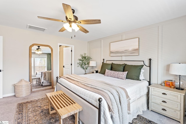 bedroom with light colored carpet and ceiling fan