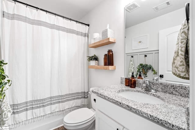 full bathroom featuring vanity, toilet, and shower / tub combo