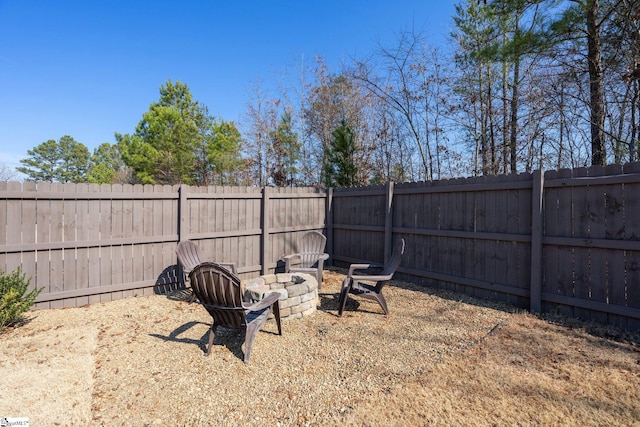 view of yard with an outdoor fire pit