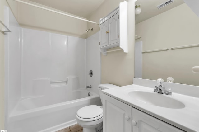 full bathroom with tile patterned floors, vanity, toilet, and washtub / shower combination