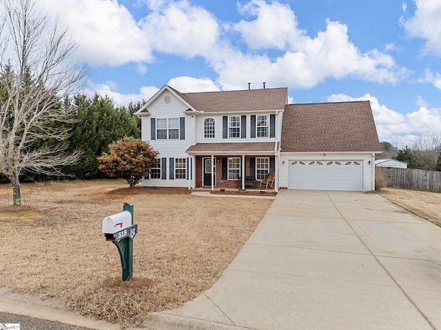 view of front of property featuring a porch and a garage