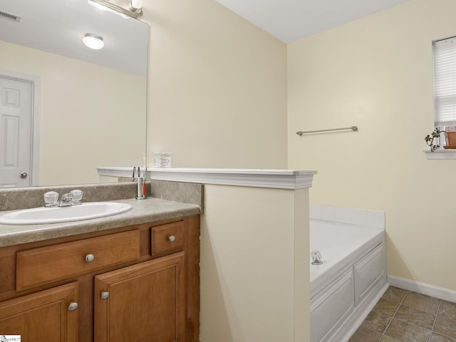 bathroom featuring vanity and a washtub