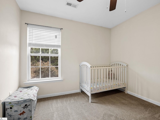 unfurnished bedroom with ceiling fan and carpet flooring