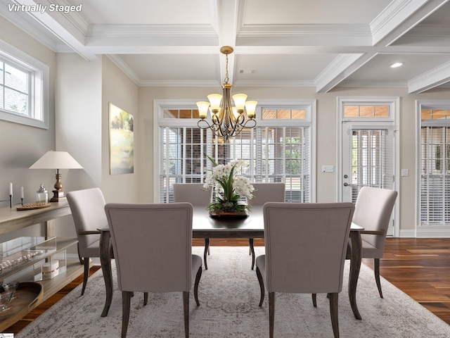 dining space featuring beam ceiling, crown molding, a notable chandelier, wood finished floors, and coffered ceiling